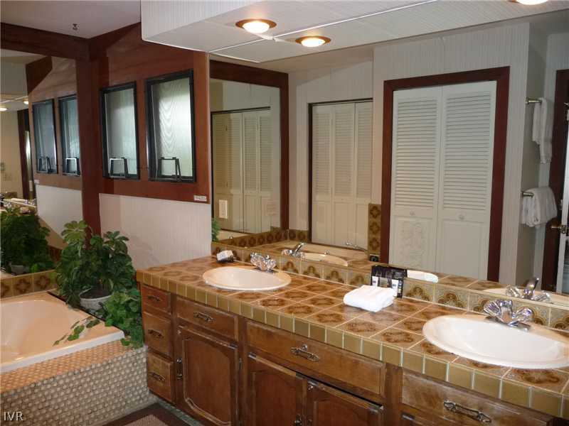 979 Cart Court Incline Village, NV 89451 - Photo 13 of 34 a bathroom with a granite countertop sink and a mirror