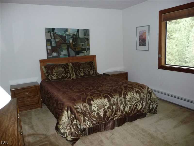 979 Cart Court Incline Village, NV 89451 - Photo 17 of 34 a bed sitting in a bedroom next to a window