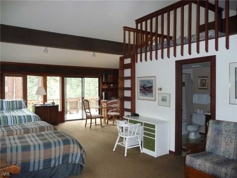 979 Cart Court Incline Village, NV 89451 - Photo 19 of 34 a bedroom with furniture and a large window