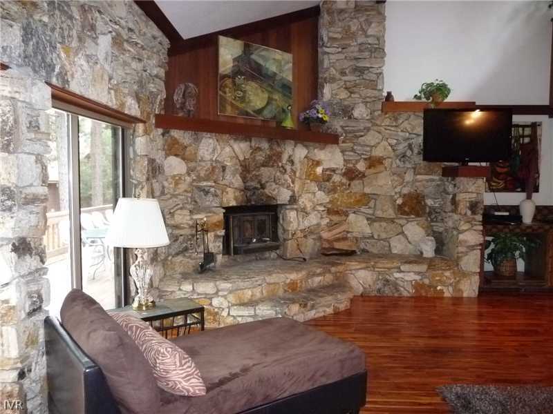 979 Cart Court Incline Village, NV 89451 - Photo 28 of 34 a living room with fireplace furniture and a flat screen tv