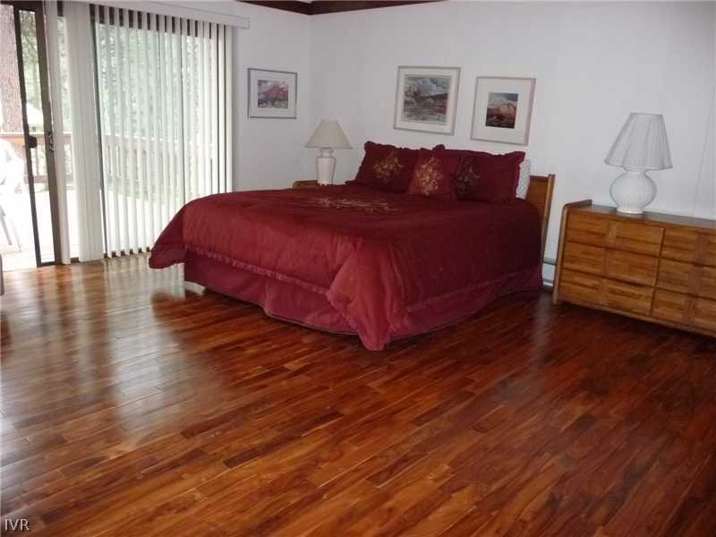 979 Cart Court Incline Village, NV 89451 - Photo 10 of 34 a bedroom with a bed and wooden floor