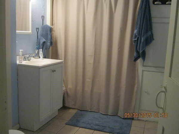 226 West Road Ashby, MA 01431 - Photo 17 of 28 a bathroom with a shower curtain and sink