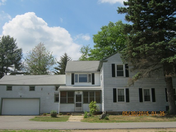 226 West Road Ashby, MA 01431 - Photo 3 of 28 a front view of a house with garden