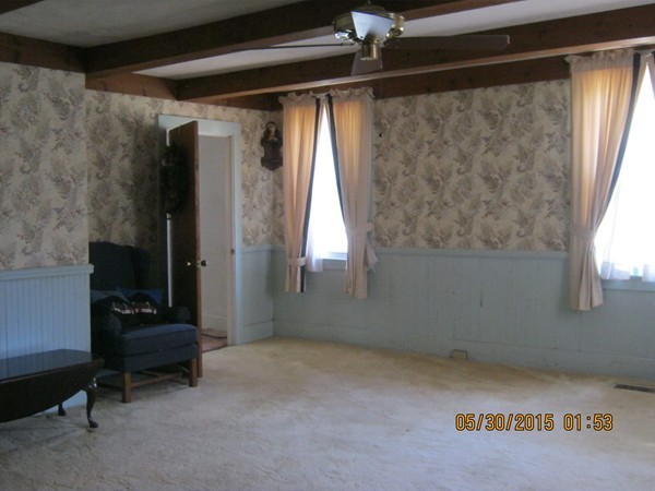 226 West Road Ashby, MA 01431 - Photo 6 of 28 a view of a livingroom with a fireplace and a window