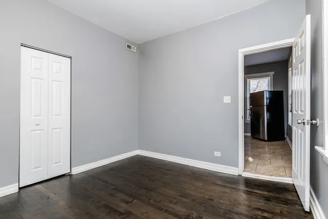 a view of a balcony with wooden floor