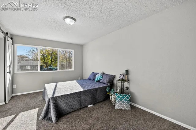 a room with a bed and a table