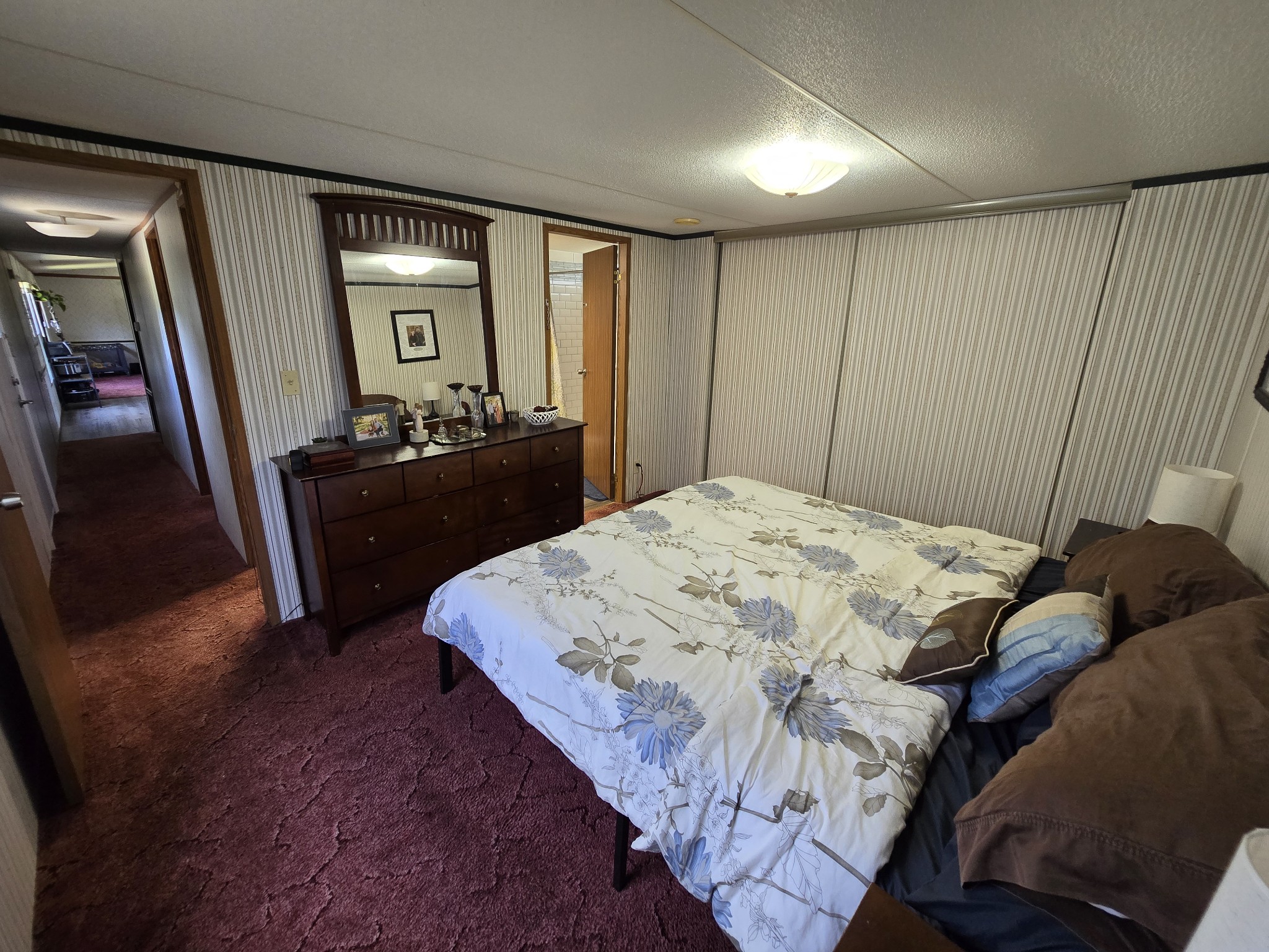 2285 Nancy Green Ridge Road Prospect, TN 38477 - Photo 11 of 17 a bedroom with a bed and dresser with mirror