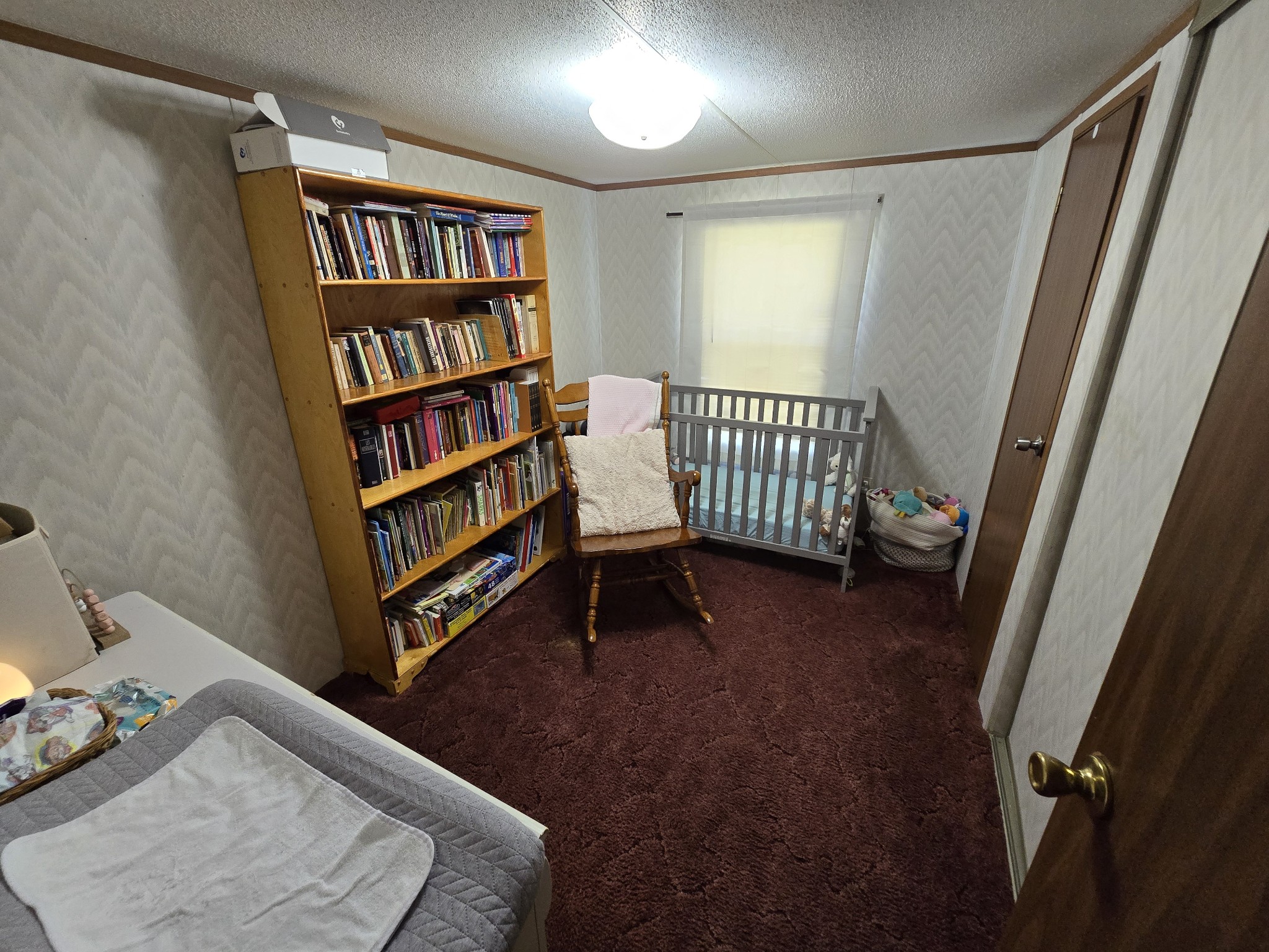 2285 Nancy Green Ridge Road Prospect, TN 38477 - Photo 14 of 17 a bedroom with a bed and a book shelf