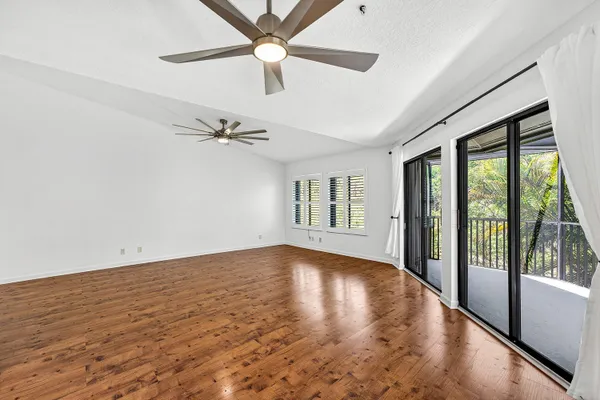 a kitchen with stainless steel appliances granite countertop wooden cabinets and a stove top oven