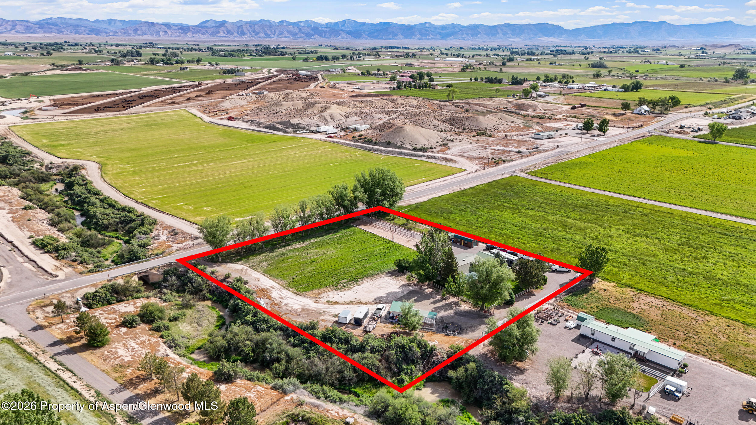 1355 N Road Loma, CO 81524 - Photo 49 of 51 an aerial view of a golf course with a swimming pool and outdoor space