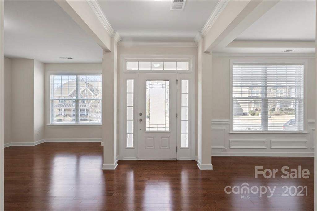 4331 Oxford Mill Road Waxhaw, NC 28173 - Photo 2 of 48 a view of an empty room with wooden floor and a window