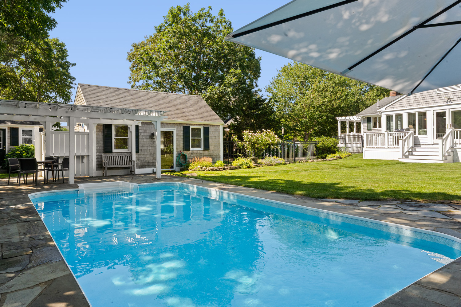 a view of a house with swimming pool