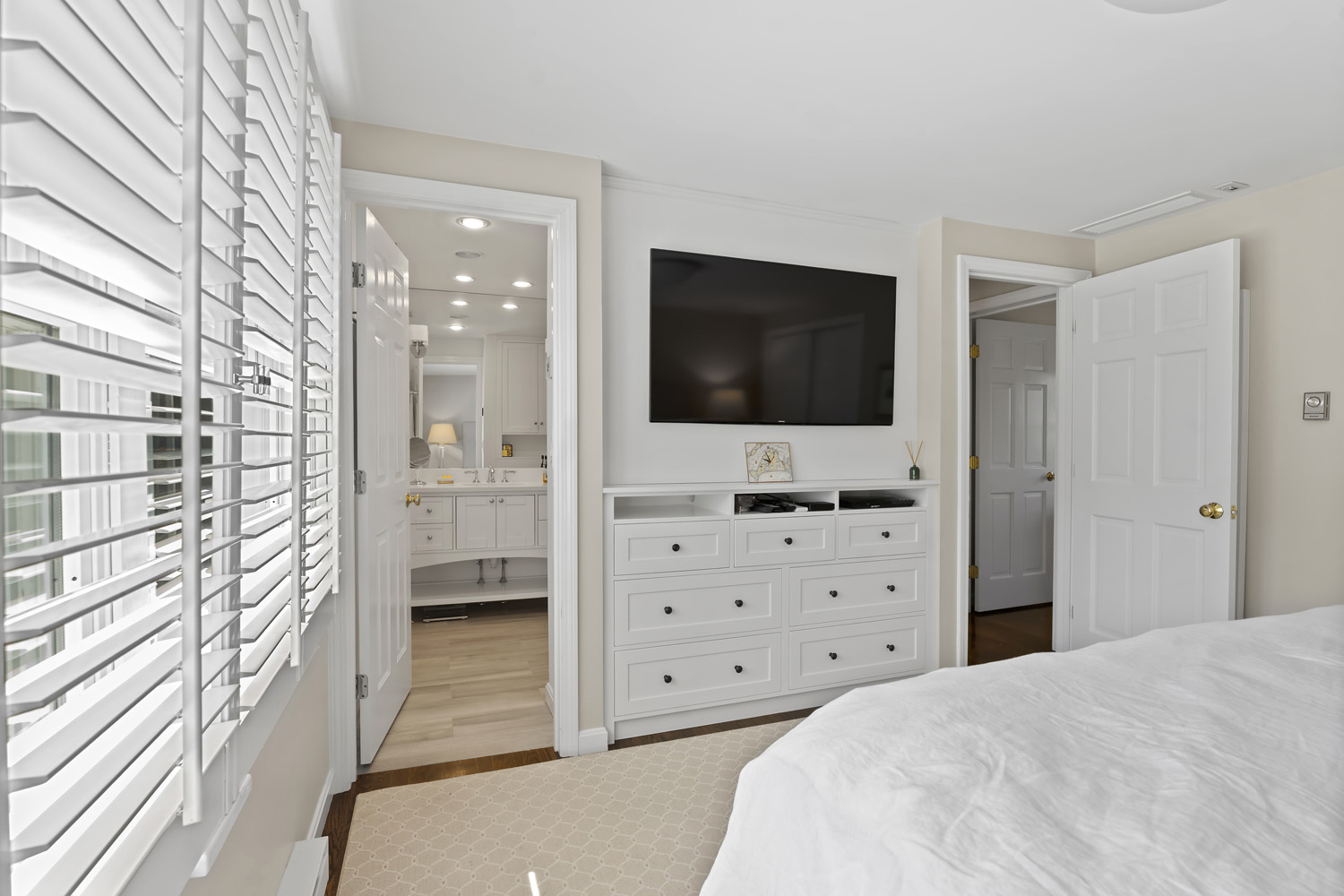 21 Kitts Field Circle Edgartown, MA 02539 - Photo 12 of 34 a view of a bedroom with cabinet and flat screen tv