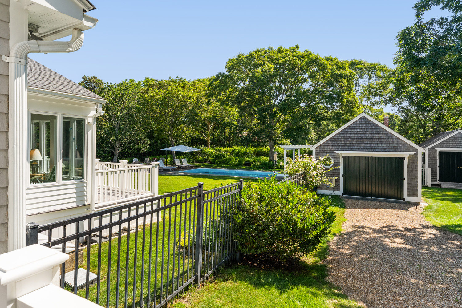 21 Kitts Field Circle Edgartown, MA 02539 - Photo 21 of 34 a view of house with swimming pool and outdoor seating