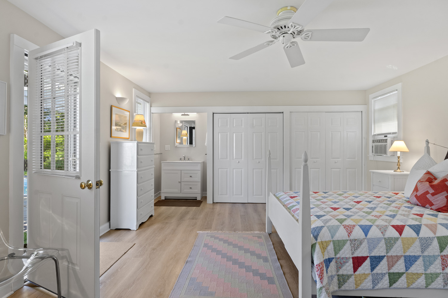 21 Kitts Field Circle Edgartown, MA 02539 - Photo 22 of 34 a bedroom with a bed and a chandelier