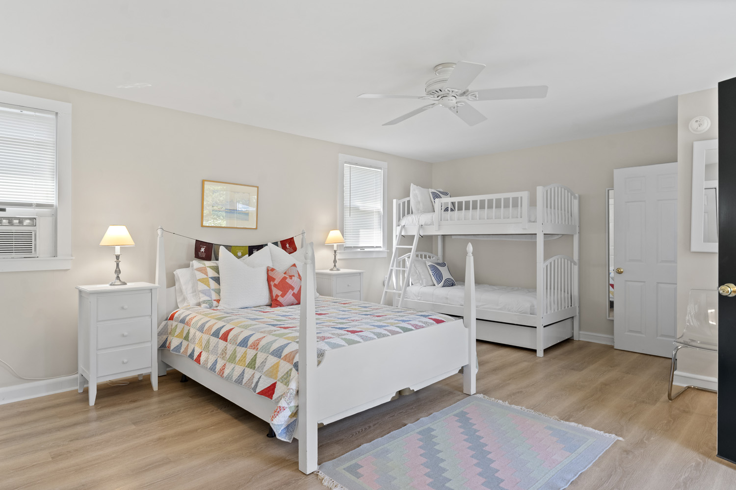 21 Kitts Field Circle Edgartown, MA 02539 - Photo 23 of 34 a bedroom with a bed and a chandelier