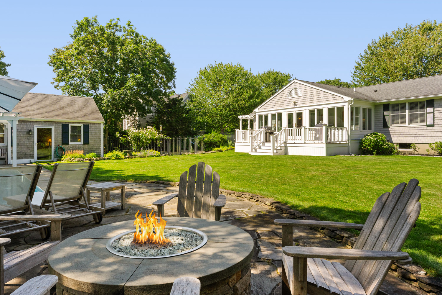 21 Kitts Field Circle Edgartown, MA 02539 - Photo 27 of 34 a view of a house with backyard sitting area and swimming pool