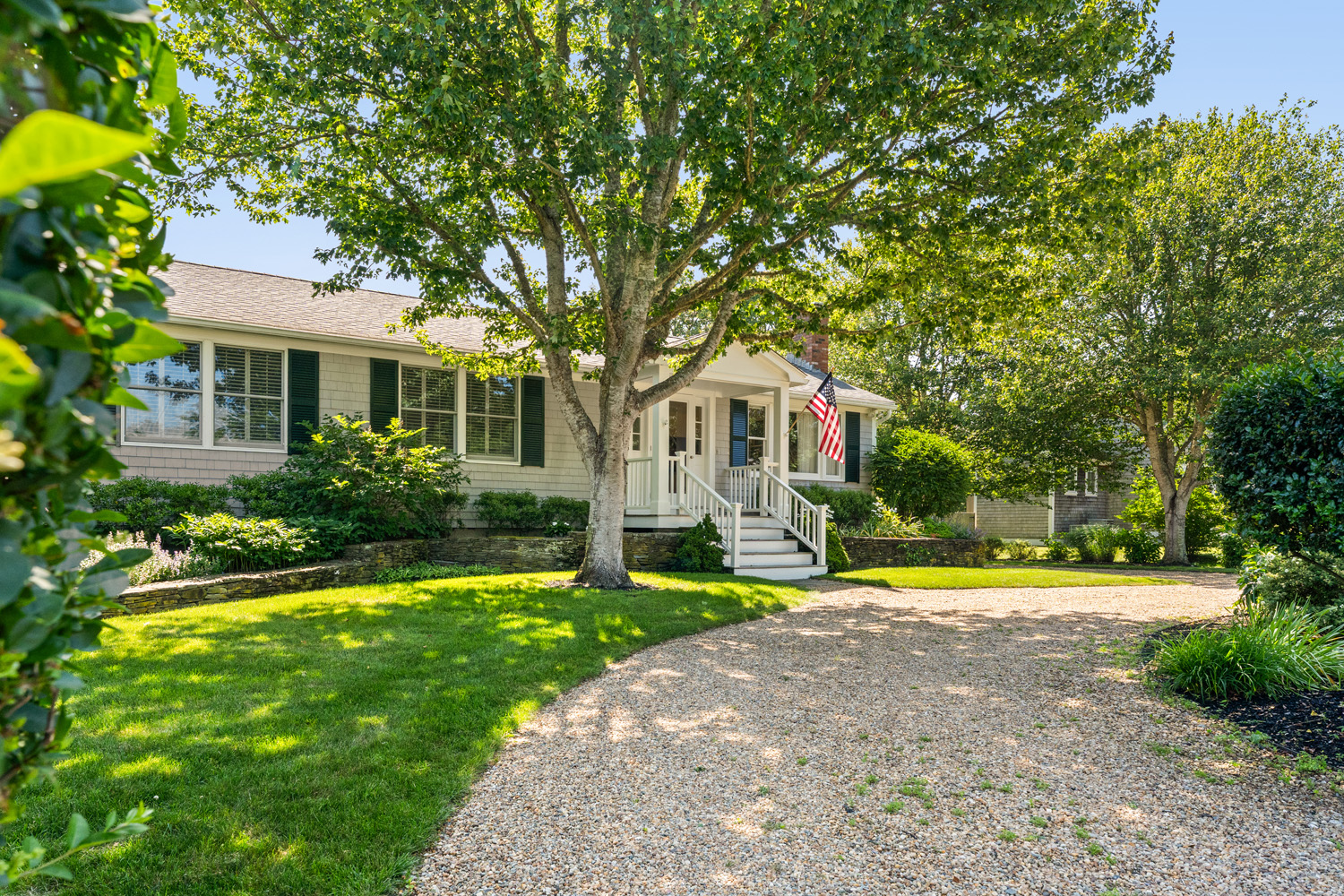 21 Kitts Field Circle Edgartown, MA 02539 - Photo 3 of 34 a front view of a house with a yard and trees