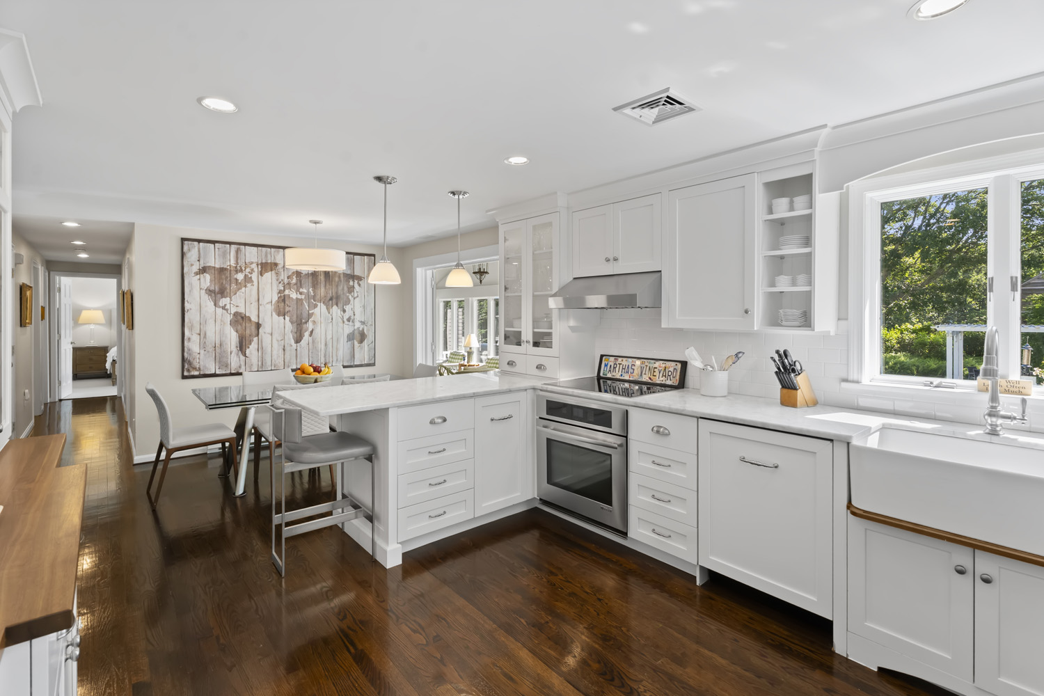 21 Kitts Field Circle Edgartown, MA 02539 - Photo 10 of 34 a kitchen with white cabinets and sink