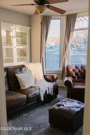 a bedroom with furniture and a window