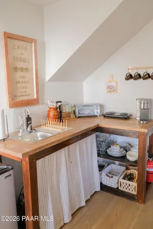 a kitchen with a sink and a stove