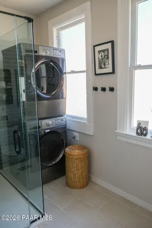 a bathroom with a sink a washer and dryer