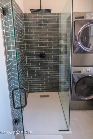 a bathroom with a sink a toilet and a shower