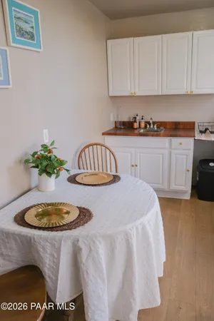 a kitchen with a sink a stove and cabinets