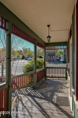 a view of a porch with a floor to ceiling window