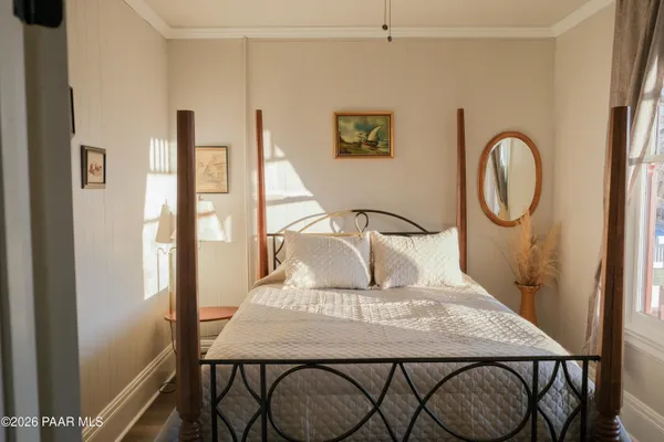 a view of a room with furniture and window