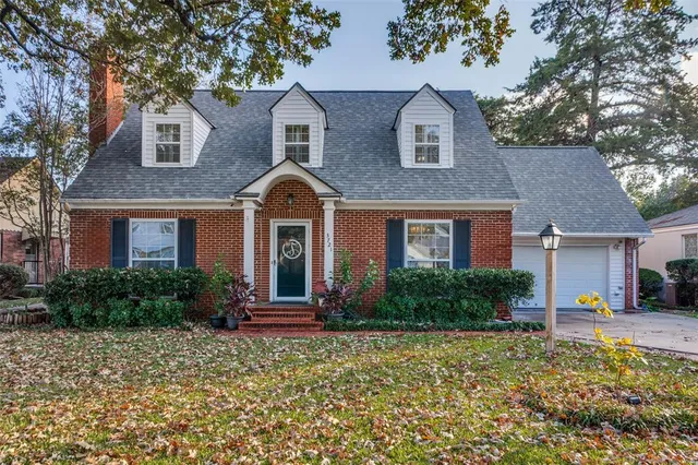 front view of brick house with a yard