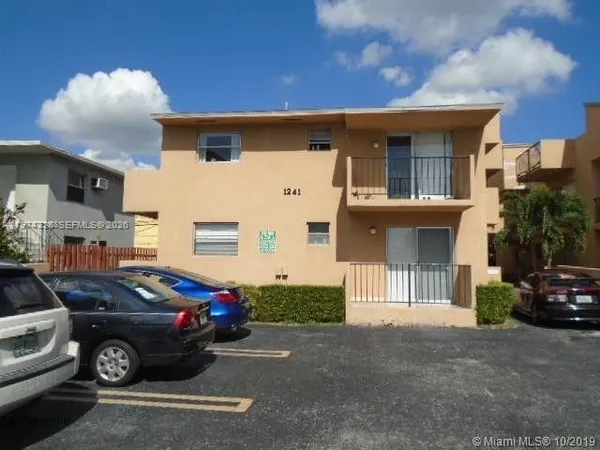 a front view of a house with parking