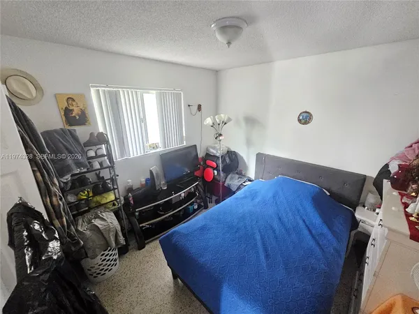 a view of a workspace with furniture and closet