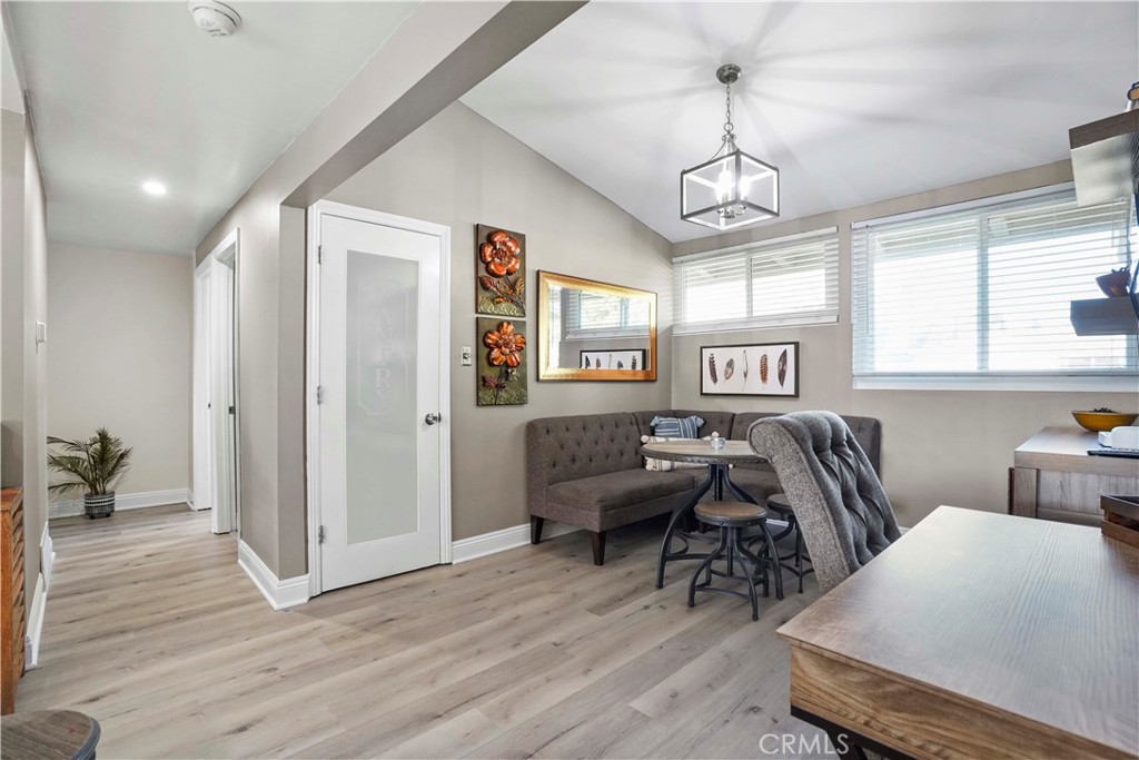 20448 Eccles Street Winnetka, CA 91306 - Photo 12 of 54 a living room with furniture and a wooden floor
