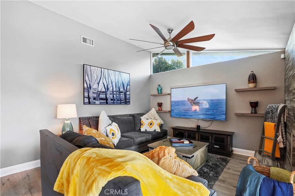 20448 Eccles Street Winnetka, CA 91306 - Photo 15 of 54 a living room with furniture and a flat screen tv