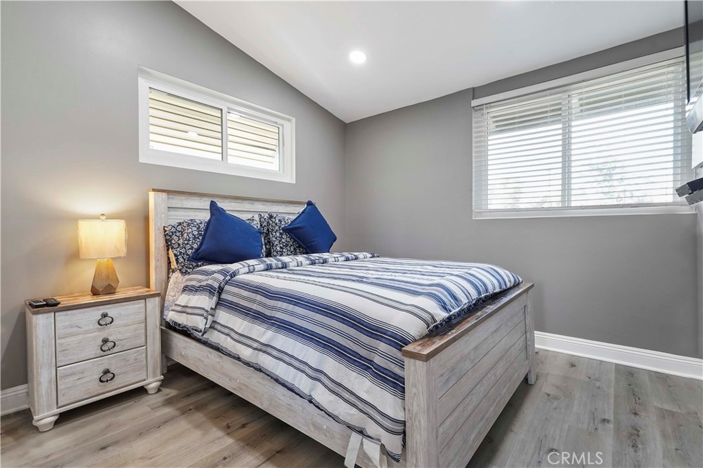 20448 Eccles Street Winnetka, CA 91306 - Photo 24 of 54 a bedroom with a bed and a window