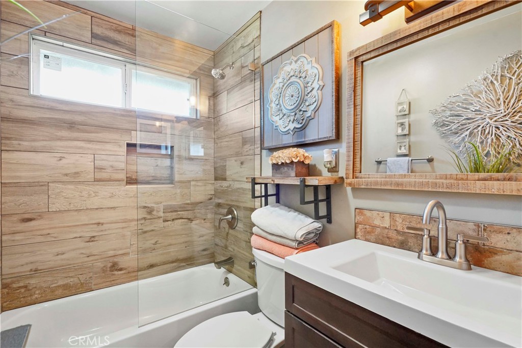 20448 Eccles Street Winnetka, CA 91306 - Photo 26 of 54 a bathroom with a sink a toilet and shower