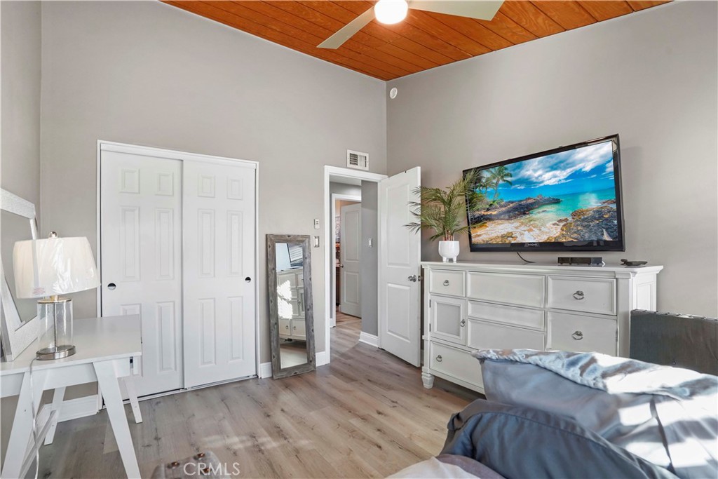 20448 Eccles Street Winnetka, CA 91306 - Photo 28 of 54 a bedroom with furniture and a flat screen tv