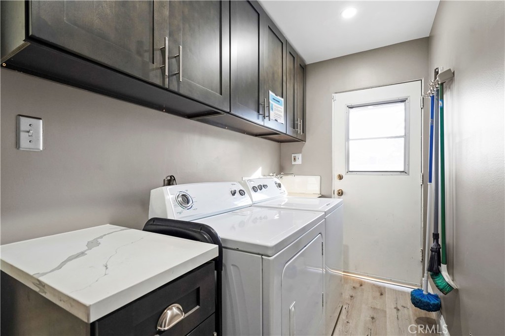 20448 Eccles Street Winnetka, CA 91306 - Photo 29 of 54 a utility room with dryer and washer