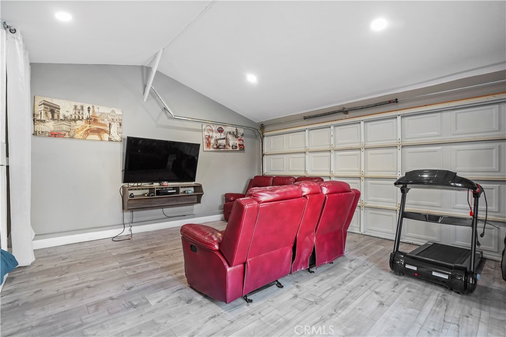 20448 Eccles Street Winnetka, CA 91306 - Photo 41 of 54 a living room with furniture and a flat screen tv