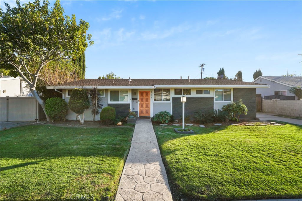 20448 Eccles Street Winnetka, CA 91306 - Photo 45 of 54 a view of a house with a yard