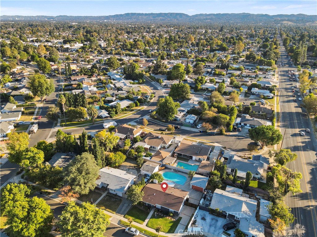 20448 Eccles Street Winnetka, CA 91306 - Photo 52 of 54 an aerial view of residential building with parking