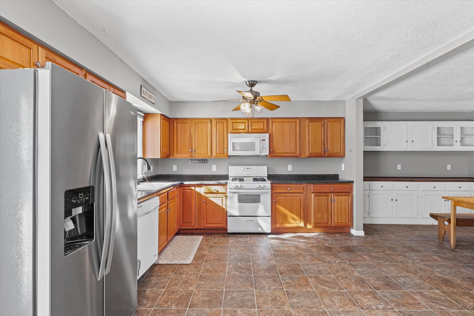 1058 North Drive Rantoul, IL 61866 - Photo 13 of 37 a kitchen with stainless steel appliances granite countertop a refrigerator and a sink