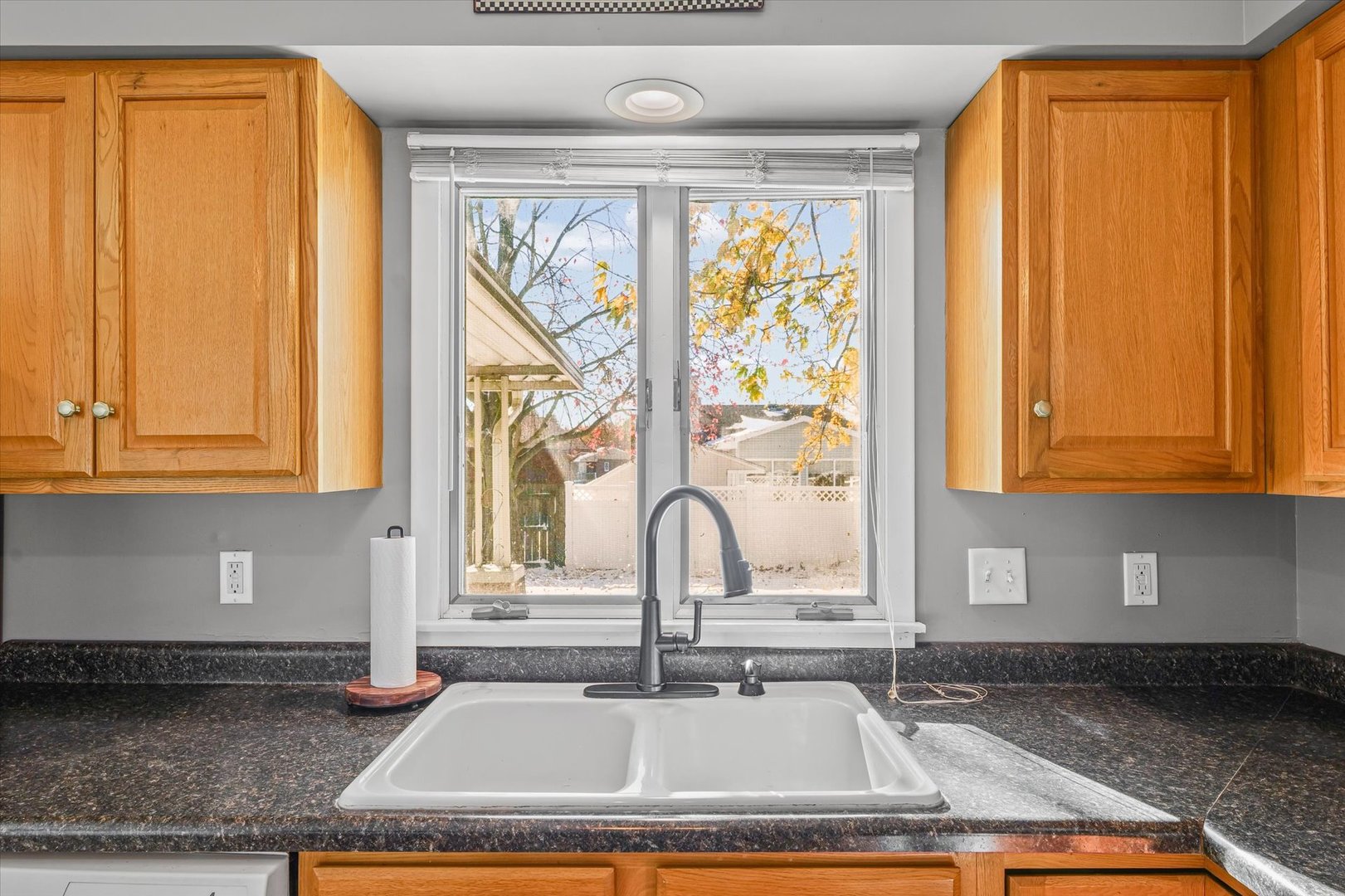 1058 North Drive Rantoul, IL 61866 - Photo 14 of 37 a kitchen with granite countertop a sink and a window