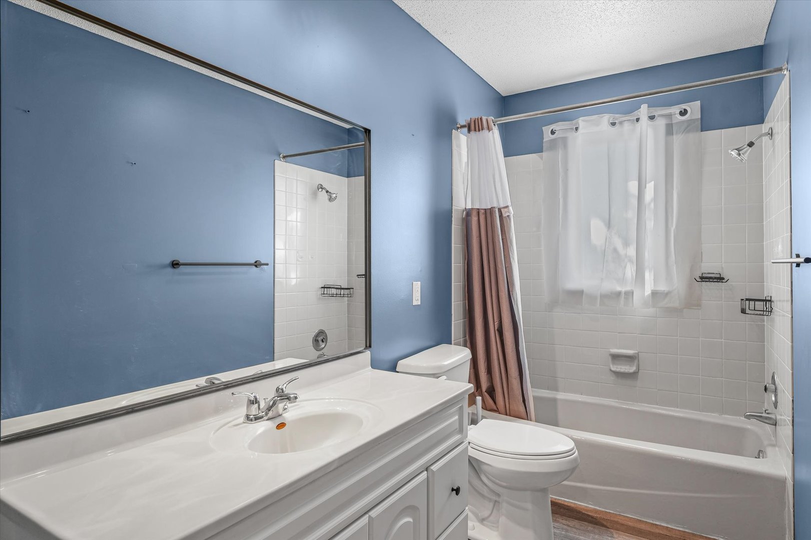 1058 North Drive Rantoul, IL 61866 - Photo 20 of 37 a bathroom with a sink toilet and shower