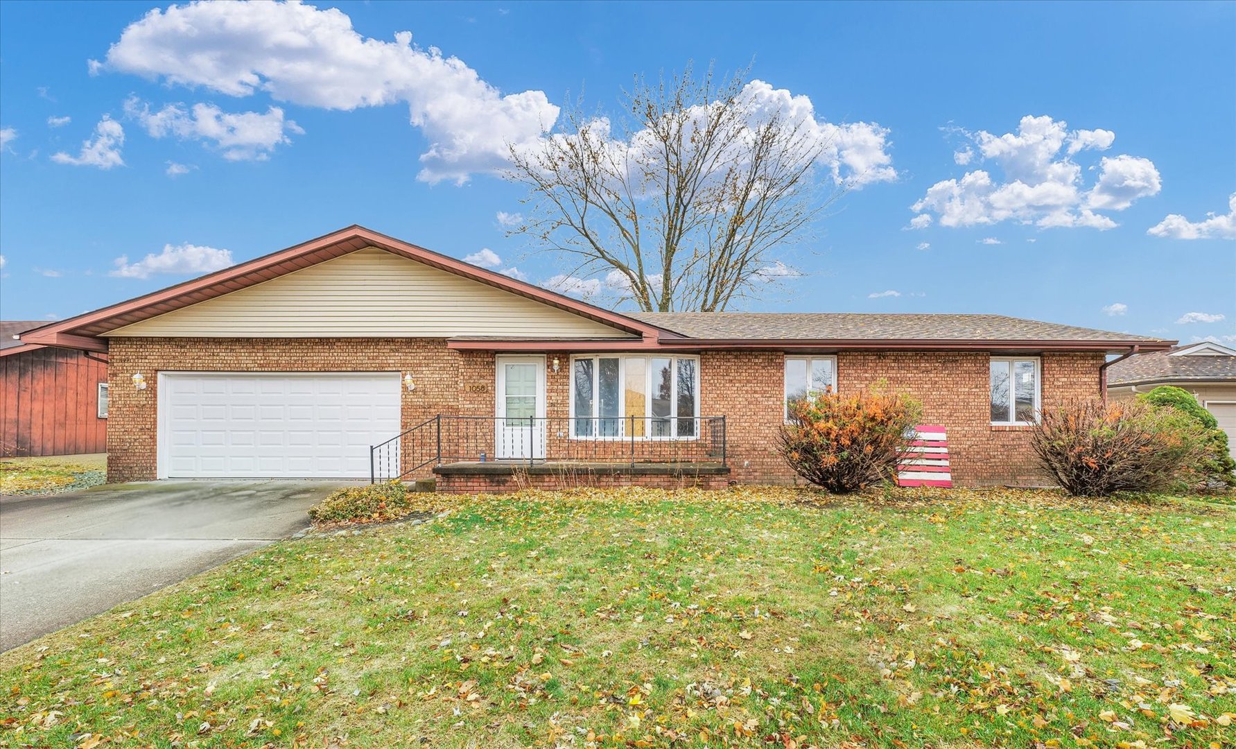 1058 North Drive Rantoul, IL 61866 - Photo 2 of 37 a front view of a house with garden