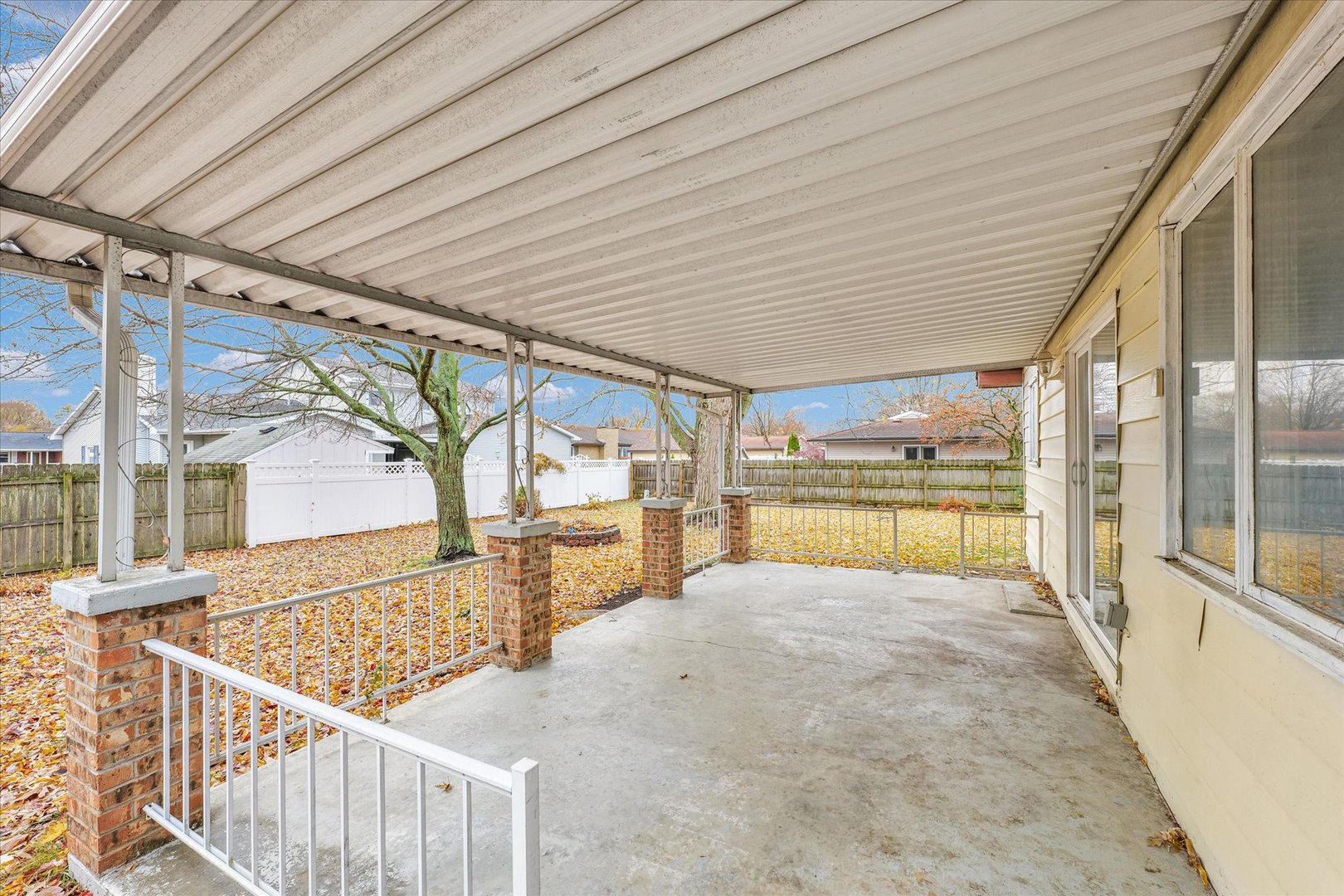 1058 North Drive Rantoul, IL 61866 - Photo 31 of 37 a view of a house with wooden floor and a iron fence