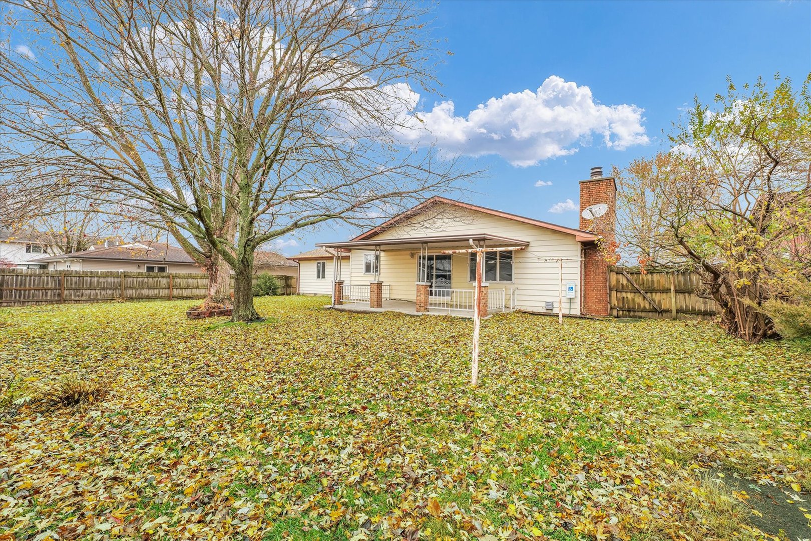 1058 North Drive Rantoul, IL 61866 - Photo 32 of 37 a large white house with a large tree in front of it