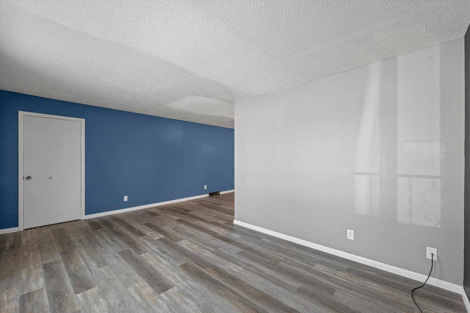 1058 North Drive Rantoul, IL 61866 - Photo 8 of 37 a view of an empty room with wooden floor