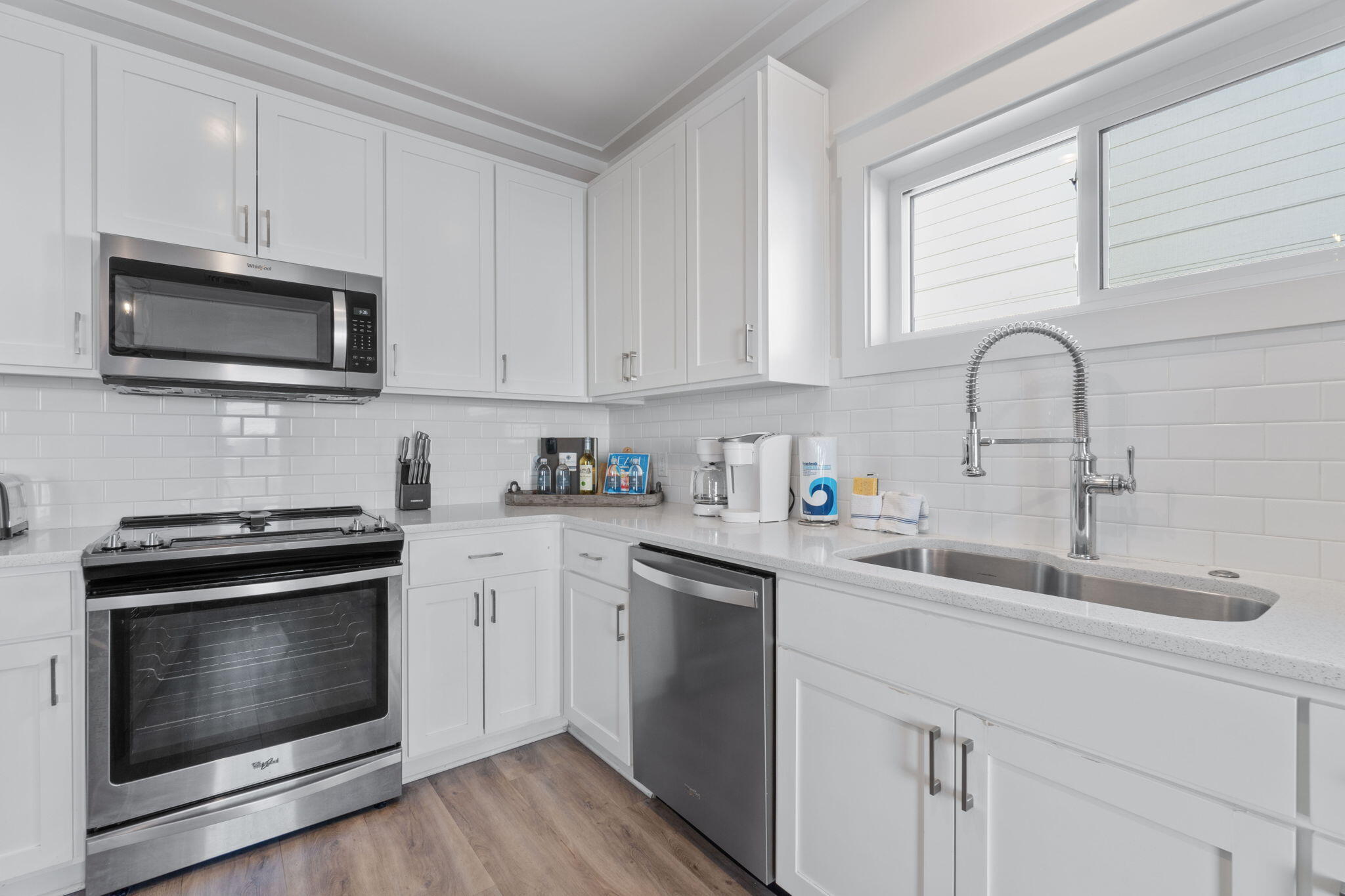 10 Blue Surf Lane Miramar Beach, FL 32550 - Photo 15 of 60 a kitchen with cabinets stainless steel appliances and sink